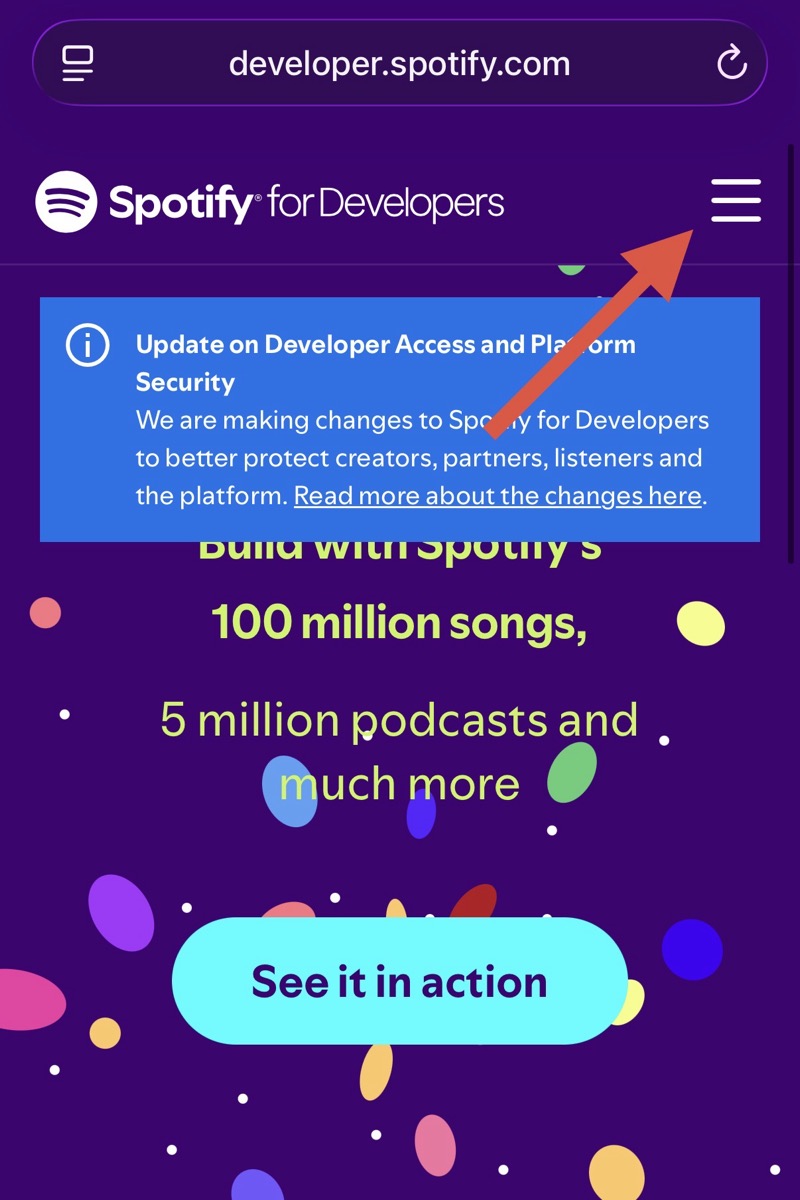 Spotify for Developers 首頁，箭頭指向右上角選單